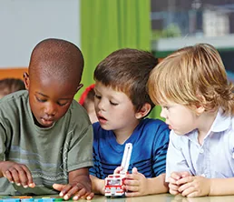 Children building with blocks at a table