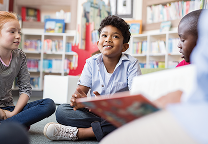Elementary School Program: Child listening to his teacher reading
